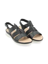 Sandalia negra con tiras de cuero y elástico con glitter, suela liviana y anatómica, tira trasera con velcro para ajuste.