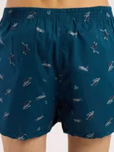 Bóxer de algodón blanco con estampado de flores pequeñas color celeste, con cintura elástica y logo de la marca en el centro.