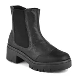 Bota casual de cuero color tostado, con elásticos laterales y cierre en la parte trasera. Tiene plataforma y suela track.