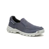 Zapatillas Caterpillar sin cordones, color azul marino, con elástico en los laterales y suela de goma color gris.