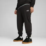 Pantalón de jogging Puma ESS N°1, color negro, con logo estampado en blanco en el muslo izquierdo.