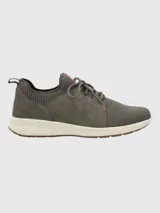 Zapatillas urbanas Hush Puppies Spinal Knit color gris, confeccionadas en cuero certificado y tejido de malla. Cuentan con ajuste de cordones, cuello y lengüeta acolchados, plantilla acolchada y suela de goma con tecnología Spinal para mejorar la postura.