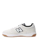 Championes New Balance modelo NM480SWG, diseñados para skate, color blanco con detalles en negro, confeccionados en gamuza y cuero, con logo "N" característico en los laterales y suela de goma color caramelo.