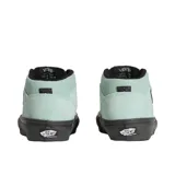 Championes de skate Vans modelo Half Cab, caña media, en color verde menta con suela y cordones negros. Presenta el parche 'Half Cab' en el lateral.