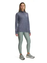 Calza de mujer Under Armour HeatGear® de tiro alto hasta el tobillo, color gris azulado, con cintura antideslizante y logo en la pierna.
