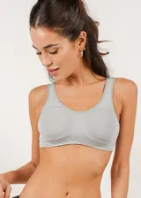 Soutien de microfibra color piel, sin costuras, sin aro y sin copa, con breteles anchos y reforzado para mayor sujeción.