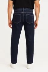 Pantalón de jean azul de corte skinny y tiro bajo.