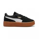 Championes Puma Palermo Elevata, color negro con franja lateral blanca y suela marrón.