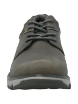 Zapato de cuero color gris oscuro con cordones y suela de goma con tecnología Honey Foam. La plantilla es de algodón orgánico con certificación GOTS.