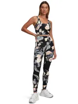 Musculosa deportiva negra con estampado floral en tonos pastel.