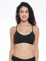 Top deportivo negro con breteles finos y espalda estilo nadador. Elástico ancho en la base con logo de la marca. Sin aro ni relleno.