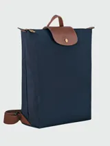Mochila Longchamp modelo Le Pliage Original M, color crudo con detalles en cuero marrón.