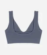 Soutien top gris de poliamida con acabado seamless, breteles anchos fijos, escote en V y etiqueta Lov.