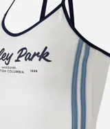 Top frente única color crema con estampado de texto "Stanley Park" en azul marino y ribetes negros.