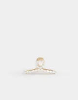 Broche dorado para el pelo con forma de pinza y apliques de perlas sintéticas.