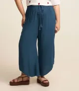 Pantalón pantacourt azul petróleo, de viscosa, con cintura elástica y lazo decorativo con borlas.