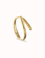 Pulsera rígida de aleación de metales bañada en oro de 18k, con forma de tubo abierto.