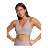 Top deportivo color lila, de tejido acanalado, con escote en V y breteles anchos.