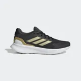 Championes de running Adidas Runfalcon 5, color negro con detalles dorados en el talón y las tres franjas laterales. Cuentan con mediasuela Cloudfoam blanca y suela Adiwear.