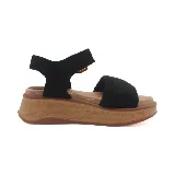 Sandalias marrones con plataforma de corcho, tira ancha sobre el empeine y pulsera al tobillo con hebilla dorada.