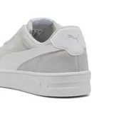 Championes Puma Court Lally SD, color gris claro con detalles en blanco.