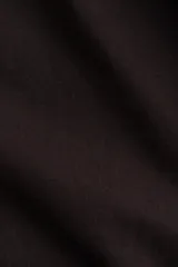 Pantalón marrón de punto de algodón, corte ancho, largo cropped, con cintura elástica y cordón de ajuste.