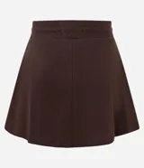 Short pollera color beige de malla de algodón con cintura elástica y lazo ajustable.