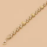 Pulsera de eslabones en plata con apliques rectangulares en oro.