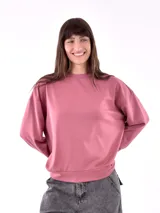 Buzo deportivo color rosa viejo, de corte holgado y mangas largas.