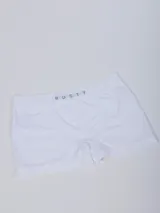 Boxer de hombre color azul marino con elástico en la cintura que lleva la marca "RUSTY" tejida en azul claro.