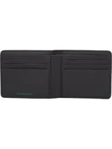 Billetera plegable de cuero negro con logo Tommy Jeans en la parte inferior. Interior con múltiples ranuras para tarjetas y billetes.
