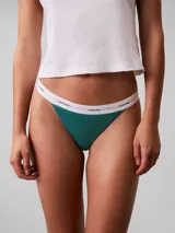 Colaless Calvin Klein color verde esmeralda con cintura elástica blanca con logo de la marca.