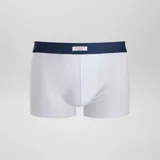 Pack de tres boxers elásticos en colores gris, verde y blanco, con diferentes patrones.