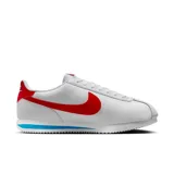 Championes Nike Cortez Leather blancos con detalles en rojo y azul.