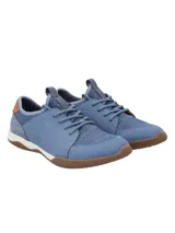 Championes Hush Puppies modelo Space, color celeste con detalles en marrón y suela marrón. Capellada de cuero con cuello de lycra y planta con tecnología GreenFoam® en base a caña de azúcar.