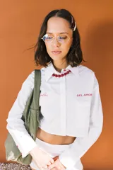 Collar de cuentas esféricas grandes, alternando colores turquesa y naranja quemado.