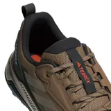 Championes Adidas Terrex Anylander color marrón con detalles en negro y rojo. Capellada de textil liviano con puntera reforzada, mediasuela de EVA y suela Traxion.