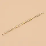 Pulsera de eslabones en plata con apliques rectangulares en oro.