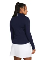 Buzo deportivo azul marino de manga larga con cierre parcial en el cuello. Confeccionado con tecnología Dri-FIT para mantener la transpirabilidad y protección UV.