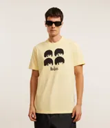 Remera color amarillo claro de algodón con cuello redondo y mangas cortas. Estampa frontal con los rostros de los integrantes de The Beatles y el logo de la banda.
