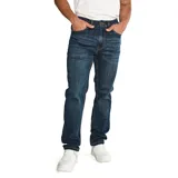 Jeans de hombre, corte slim, color azul oscuro con efecto lavado (dark stone). Presenta cierre de cremallera y botón, diseño de cinco bolsillos y parches con logo CAT en la cintura trasera y bolsillo trasero.