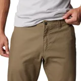 Pantalón de hombre color azul marino, de corte recto, con bolsillos laterales, bolsillos de seguridad con cierre y bolsillo para cuchillo. Confeccionado en tejido elástico con tecnología Omni-Shade UPF 50.