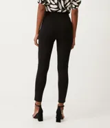Pantalón legging negro de punto roma con cintura alta y detalle de solapa en la parte delantera confeccionada en material sintético.
