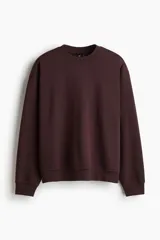 Buzo de tejido de mezcla de algodón de peso medio con interior cepillado suave. Modelo con cuello redondo ribeteado, hombros caídos y remate acanalado ancho en puños y bajo. Corte holgado.