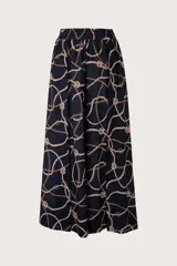 Pantalón largo de corte recto, color azul oscuro con estampado de cadenas y cuerdas doradas y blancas. Tiene cintura elástica.