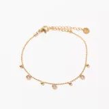 Pulsera dorada con cadena de bolitas y dijes colgantes de bolitas y circonitas engarzadas.