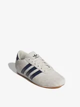 Championes Adidas Taekwondo Lace color crema con detalles en azul marino.
