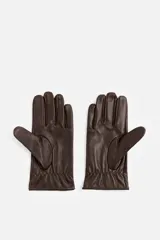 Guantes de cuero marrón con forro interior de punto y ajuste elástico en la muñeca.