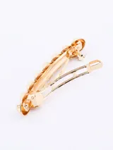 Broche dorado para el pelo con forma de eslabones.