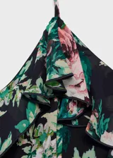 Vestido largo de gasa con estampado floral, tirantes finos ajustables, escote en pico y volantes en el cuello y en el bajo.